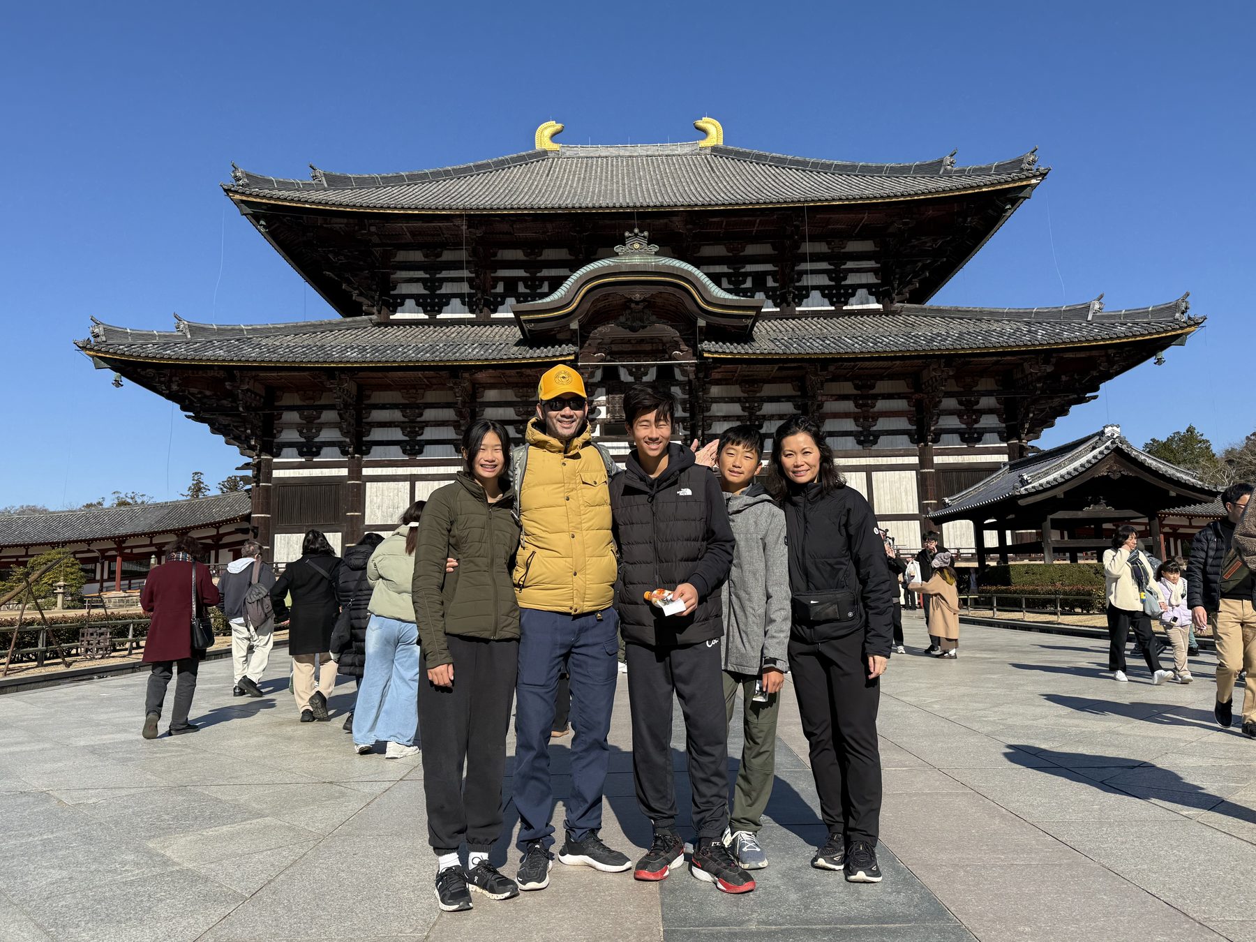 The family under the torii gates at Fushimi Inari