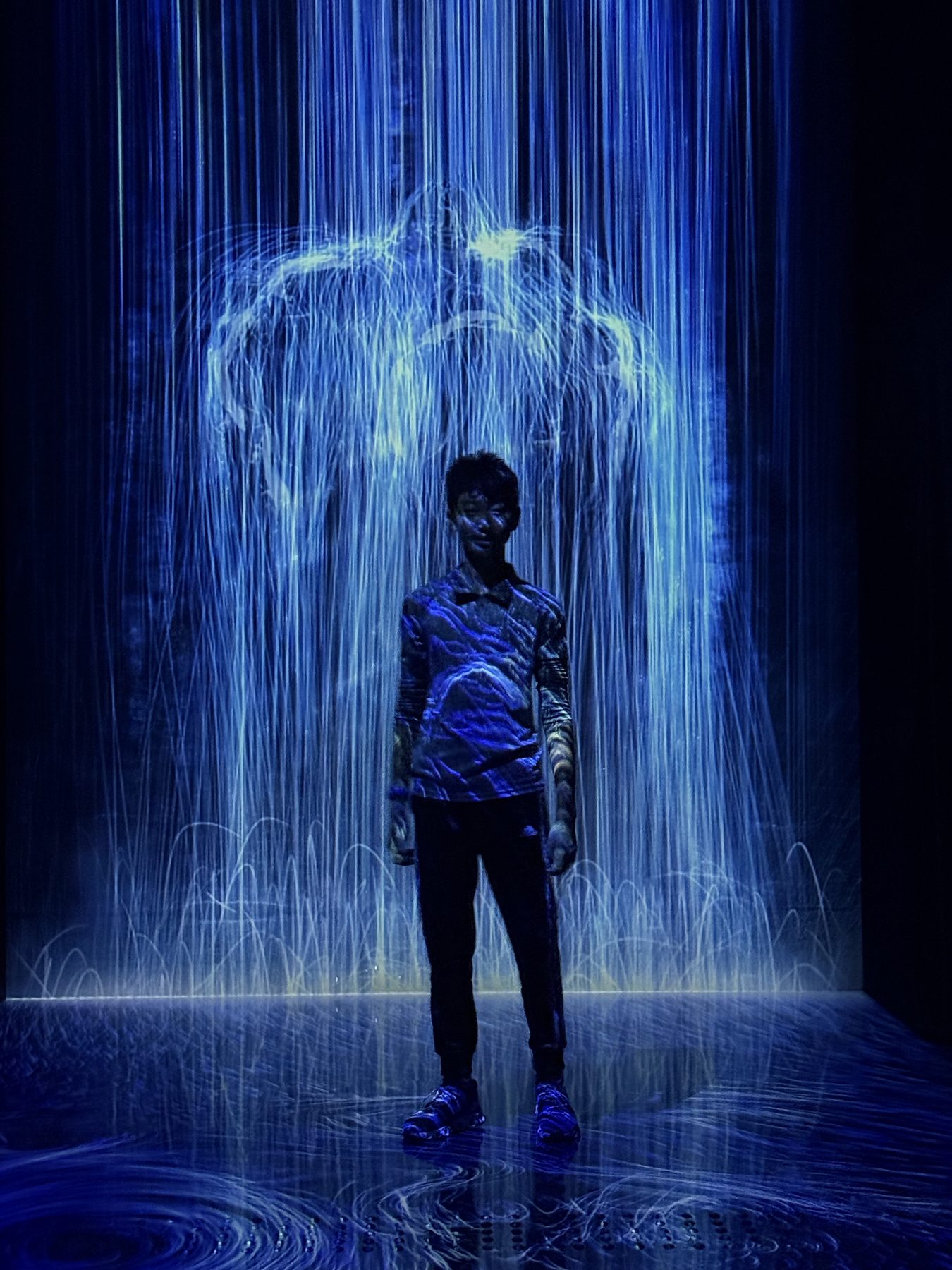 Standing under the waterfall.